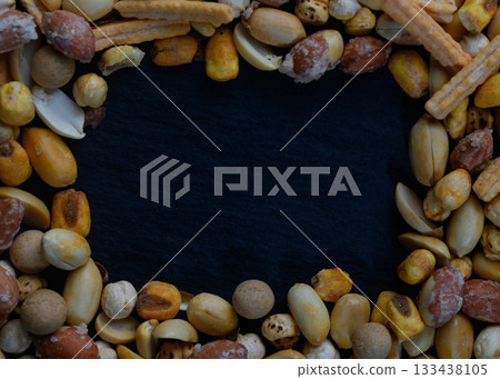Colorful assortment of nuts and snacks creates an inviting frame for culinary creativity Colorful assortment of nuts and snacks creates an inviting frame for culinary creativity 133438105