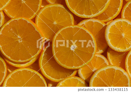 Vibrant citrus slices arranged beautifully, celebrating summer's bounty in a sunlit kitchen Vibrant citrus slices arranged beautifully, celebrating summer's bounty in a sunlit kitchen 133438115