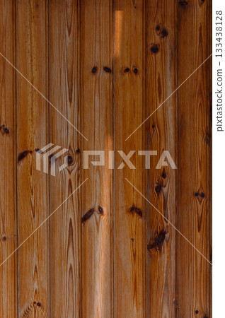 Warm tones of rustic wooden boards enhancing the cozy atmosphere in a cabin retreat during the early morning light Warm tones of rustic wooden boards enhancing the cozy atmosphere in a cabin retreat during the early morning light 133438128