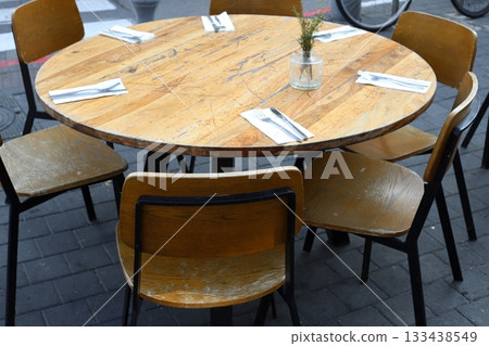 Chair and table in a city cafe on the seafront in Tel Aviv. 133438549