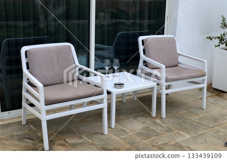 Chair and table in a city cafe on the seafront in Tel Aviv. Chair and table in a city cafe on the seafront in Tel Aviv. 133439109
