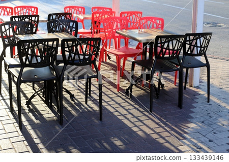 Chair and table in a city cafe on the seafront in Tel Aviv. 133439146