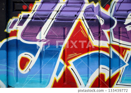 Colorful background of graffiti painting artwork with bright aerosol outlines on wall. Old school street art piece made with aerosol spray paint cans. Contemporary youth culture backdrop Colorful background of graffiti painting artwork with bright aerosol outlines on wall. Old school street art piece made with aerosol spray paint cans. Contemporary youth culture backdrop 133439772