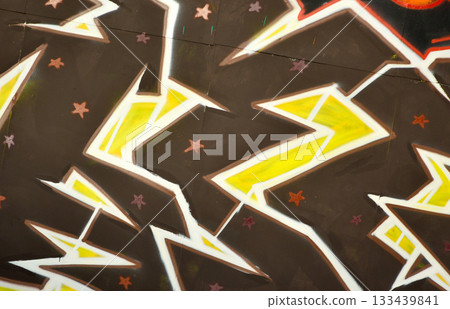 Colorful background of graffiti painting artwork with bright aerosol outlines on wall. Old school street art piece made with aerosol spray paint cans. Contemporary youth culture backdrop Colorful background of graffiti painting artwork with bright aerosol outlines on wall. Old school street art piece made with aerosol spray paint cans. Contemporary youth culture backdrop 133439841