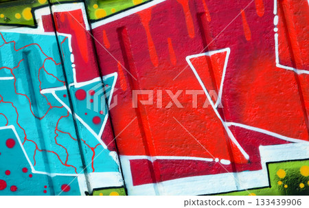Colorful background of graffiti painting artwork with bright aerosol outlines on wall. Old school street art piece made with aerosol spray paint cans. Contemporary youth culture backdrop 133439906