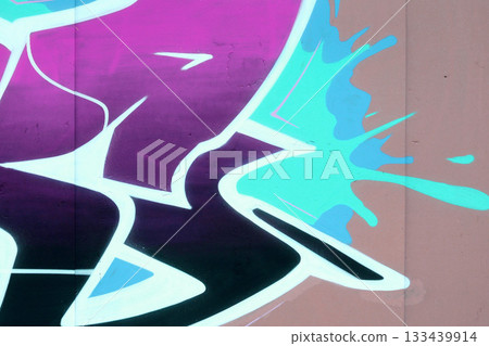 Colorful background of graffiti painting artwork with bright aerosol outlines on wall. Old school street art piece made with aerosol spray paint cans. Contemporary youth culture backdrop 133439914