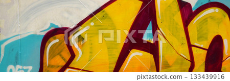 Colorful background of graffiti painting artwork with bright aerosol outlines on wall. Old school street art piece made with aerosol spray paint cans. Contemporary youth culture backdrop 133439916