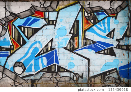 Colorful background of graffiti painting artwork with bright aerosol outlines on wall. Old school street art piece made with aerosol spray paint cans. Contemporary youth culture backdrop Colorful background of graffiti painting artwork with bright aerosol outlines on wall. Old school street art piece made with aerosol spray paint cans. Contemporary youth culture backdrop 133439918
