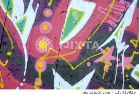 Colorful background of graffiti painting artwork with bright aerosol outlines on wall. Old school street art piece made with aerosol spray paint cans. Contemporary youth culture backdrop Colorful background of graffiti painting artwork with bright aerosol outlines on wall. Old school street art piece made with aerosol spray paint cans. Contemporary youth culture backdrop 133439929