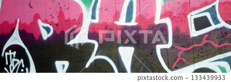 Colorful background of graffiti painting artwork with bright aerosol outlines on wall. Old school street art piece made with aerosol spray paint cans. Contemporary youth culture backdrop Colorful background of graffiti painting artwork with bright aerosol outlines on wall. Old school street art piece made with aerosol spray paint cans. Contemporary youth culture backdrop 133439933