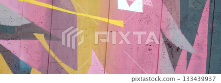 Colorful background of graffiti painting artwork with bright aerosol outlines on wall. Old school street art piece made with aerosol spray paint cans. Contemporary youth culture backdrop 133439937