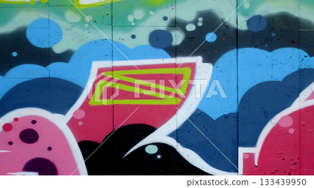 Colorful background of graffiti painting artwork with bright aerosol outlines on wall. Old school street art piece made with aerosol spray paint cans. Contemporary youth culture backdrop Colorful background of graffiti painting artwork with bright aerosol outlines on wall. Old school street art piece made with aerosol spray paint cans. Contemporary youth culture backdrop 133439950