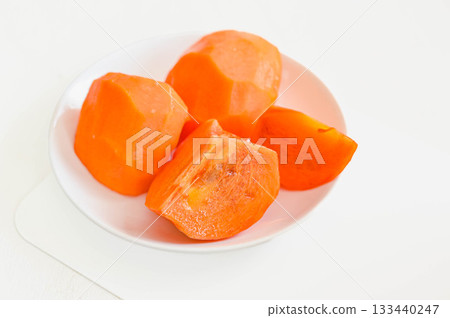 Cut persimmon Cut persimmon 133440247