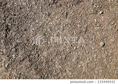 Background of shattered stony stones surface in mountain area. Flat texture with natural light Background of shattered stony stones surface in mountain area. Flat texture with natural light 133440432