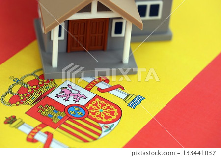 Residential house on Spanish flag close up. Concept of Squatting in Spain. Okupas problem 133441037