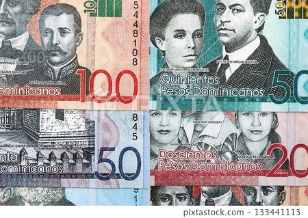 Dominican Republic Pesos currency money bills. DOP currency banknotes in big amount with different denomination close up Dominican Republic Pesos currency money bills. DOP currency banknotes in big amount with different denomination close up 133441113