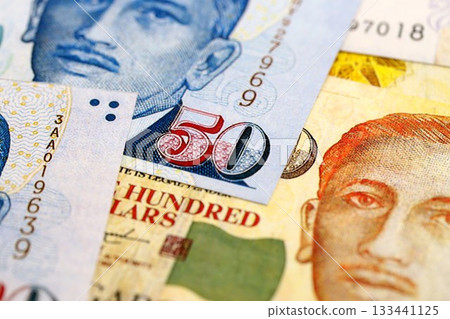 Singapore Dollar currency money bills. SGD currency banknotes in bunch with different denomination close up Singapore Dollar currency money bills. SGD currency banknotes in bunch with different denomination close up 133441125