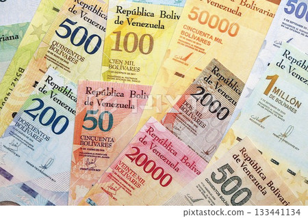 Venezuelan Bolivar currency money bills in big amount. Pile of VED currency banknotes with different denomination close up 133441134