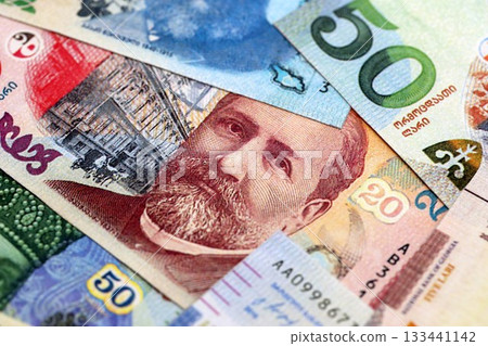 Georgian Lari currency money bills. GEL currency banknotes in pile with different denomination close up 133441142