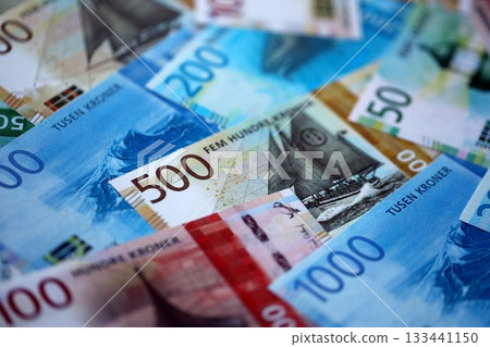 Norwegian Krone currency money bills. NOK currency banknotes in stack with different denomination close up Norwegian Krone currency money bills. NOK currency banknotes in stack with different denomination close up 133441150