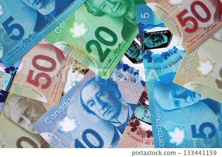 Canadian Dollar currency money bills. CAD currency banknotes in big stack with different denomination close up 133441159