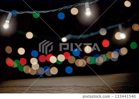 Simple composition of a dark background and Christmas lights 133441540