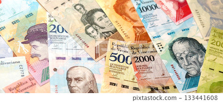 Venezuelan Bolivar currency money bills in stack. VED currency banknotes with different denomination close up Venezuelan Bolivar currency money bills in stack. VED currency banknotes with different denomination close up 133441608