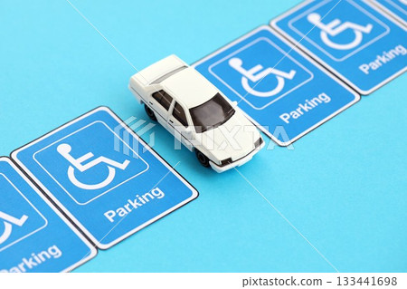 Parking permit paper notice tag for car interior and toy car. Parking permit for people with disabilities concept. Vip private parking 133441698