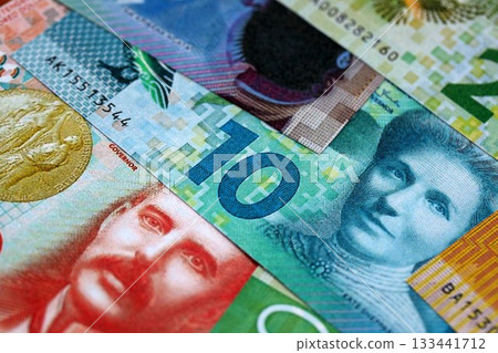New Zealand dollar money bills in big amount on table close up. Rich life concept in New Zealand. Business and economy New Zealand dollar money bills in big amount on table close up. Rich life concept in New Zealand. Business and economy 133441712