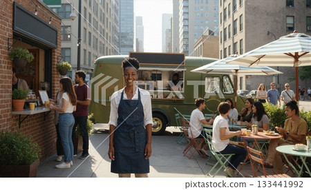 Smiling woman owner standing in front of urban food truck cafe with customers. 133441992