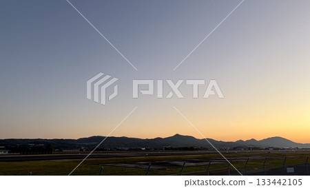 The airport and mountains at dusk The airport and mountains at dusk 133442105