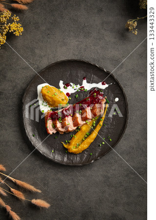 Seared duck fillet with puree and sauce Seared duck fillet with puree and sauce 133443329