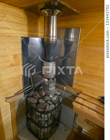 Classic Sauna Heater Design with Natural Stones 133443702