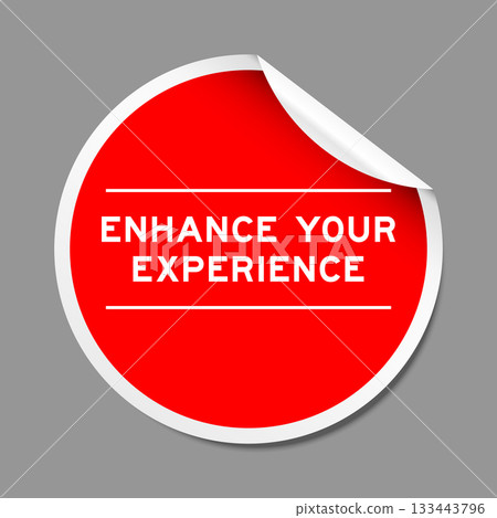 Red color peel sticker label with word enhance your experience on gray background Red color peel sticker label with word enhance your experience on gray background 133443796