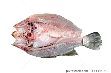 Raw, prepared whole fish, filleted open showing clean white flesh and delicate bones. Isolated, ready for cooking or seafood preparation. Fresh, natural ingredients. 133444969