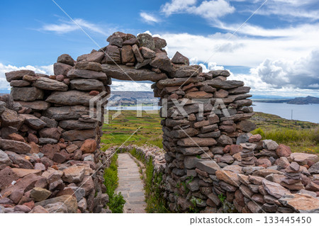 Stone pathway and arch at Pachatata archaeological site, Amantani Island, La ke Titicaca, Peru 133445450