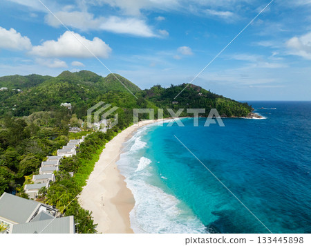 The dynamic ocean waves create an idyllic and vibrant beach experience. Seychelles, Mahe. Anse Intendance beach. The dynamic ocean waves create an idyllic and vibrant beach experience. Seychelles, Mahe. Anse Intendance beach. 133445898