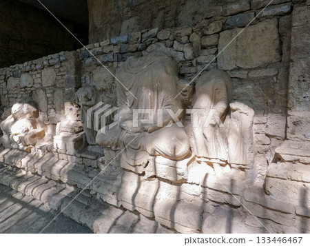 Heritage Seated Buddha statue carved into stupa wall Mohra Muradu Gandhara Buddhist ruins Taxila Pakistan 133446467