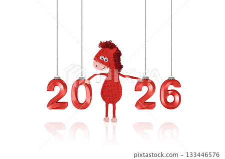 Crocheted toy fiery red horse and red numbers. The symbol of the year 2026 on a white background. Chinese New Year greeting card Crocheted toy fiery red horse and red numbers. The symbol of the year 2026 on a white background. Chinese New Year greeting card 133446576