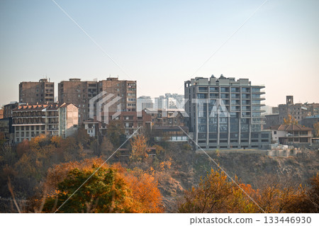 A city skyline with a large building in the middle A city skyline with a large building in the middle 133446930