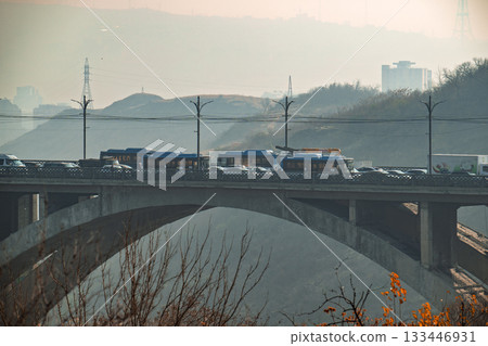 A bridge over a highway with a lot of traffic 133446931
