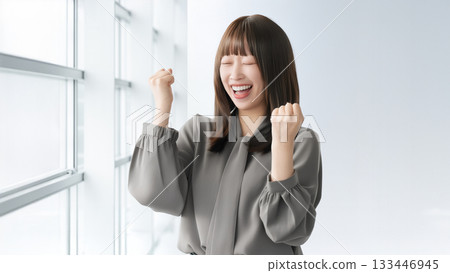 Woman/businesswoman doing a fist pump Woman/businesswoman doing a fist pump 133446945