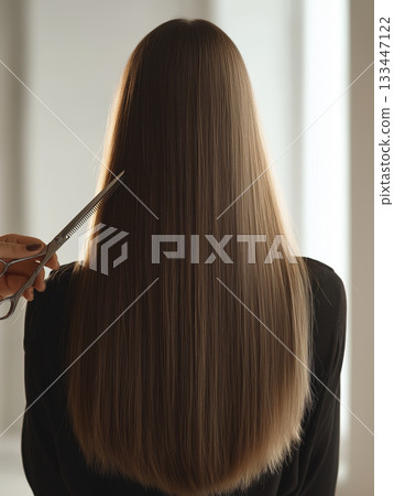 Long straight hair brunette back view salon haircut scissors silky natural shine calm mood 133447122