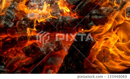 Close-up of Hot Embers with Flying Sparks . Concept of heating grills or ovens 133448069
