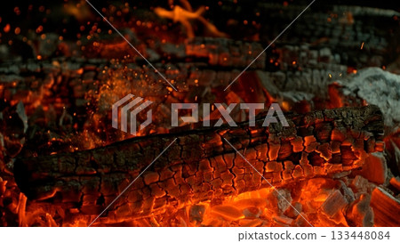 Close-up of Hot Embers with Flying Sparks . Concept of heating grills or ovens 133448084