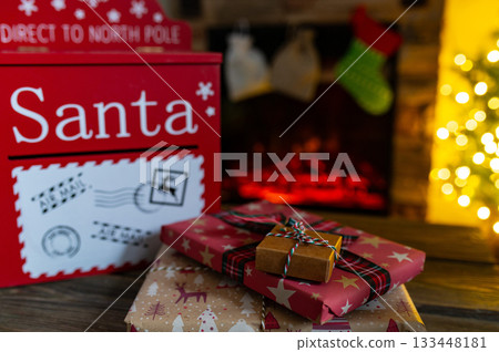 Santa Mailbox with Christmas Gifts and Festive Holiday Decor Indoors Santa Mailbox with Christmas Gifts and Festive Holiday Decor Indoors 133448181