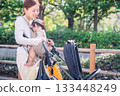Mother and child going out with a stroller 133448249