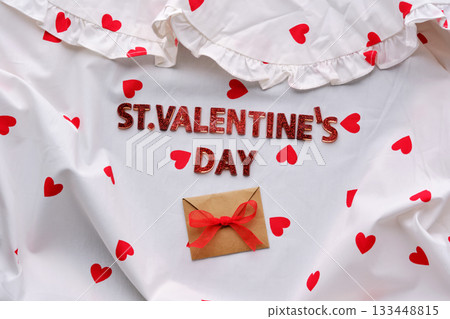 Festive St. Valentine's Day background of a white cotton blouse with hearts. Festive St. Valentine's Day background of a white cotton blouse with hearts. 133448815