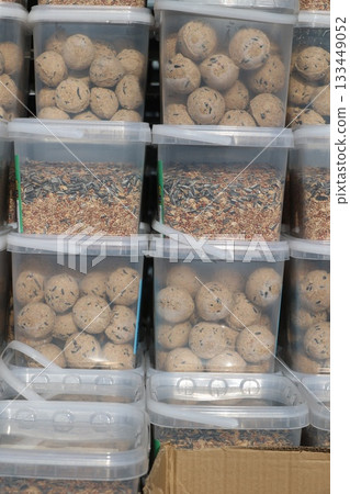 Storage containers with bird food and seed balls Storage containers with bird food and seed balls 133449052