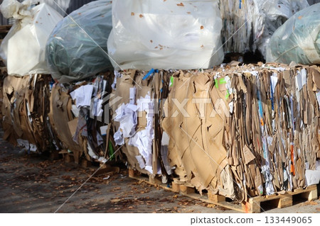Recycled cardboard bales at a waste management facility 133449065